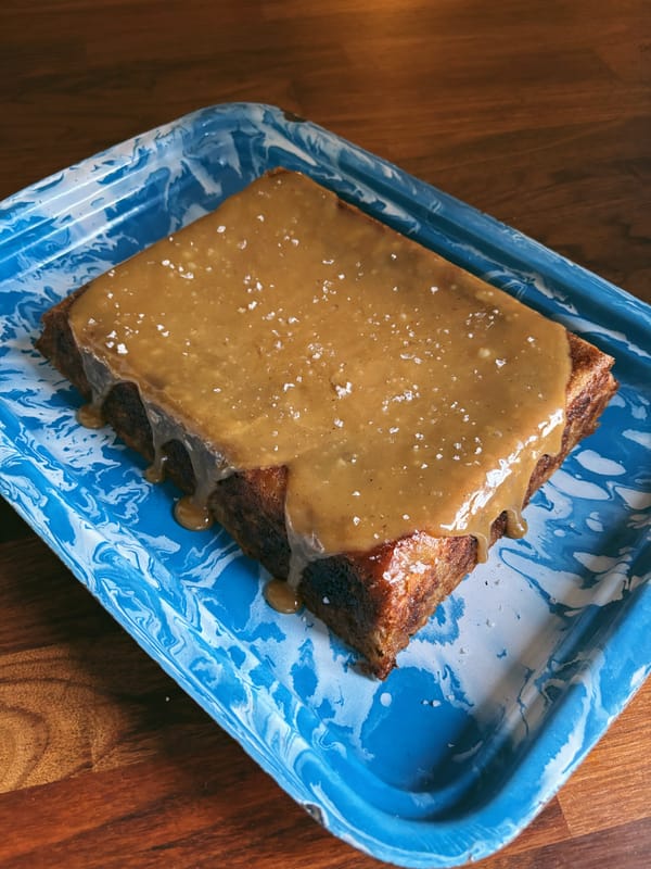 Photograph of Zaynab Issa's caramel apple snacking cake on a blue platter